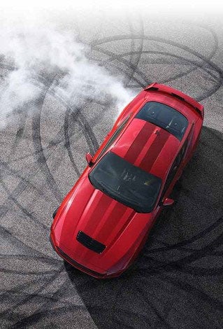 Overhead view of a 2024 Ford Mustang® model with tire tracks on pavement | SouthWest Ford in Weatherford TX